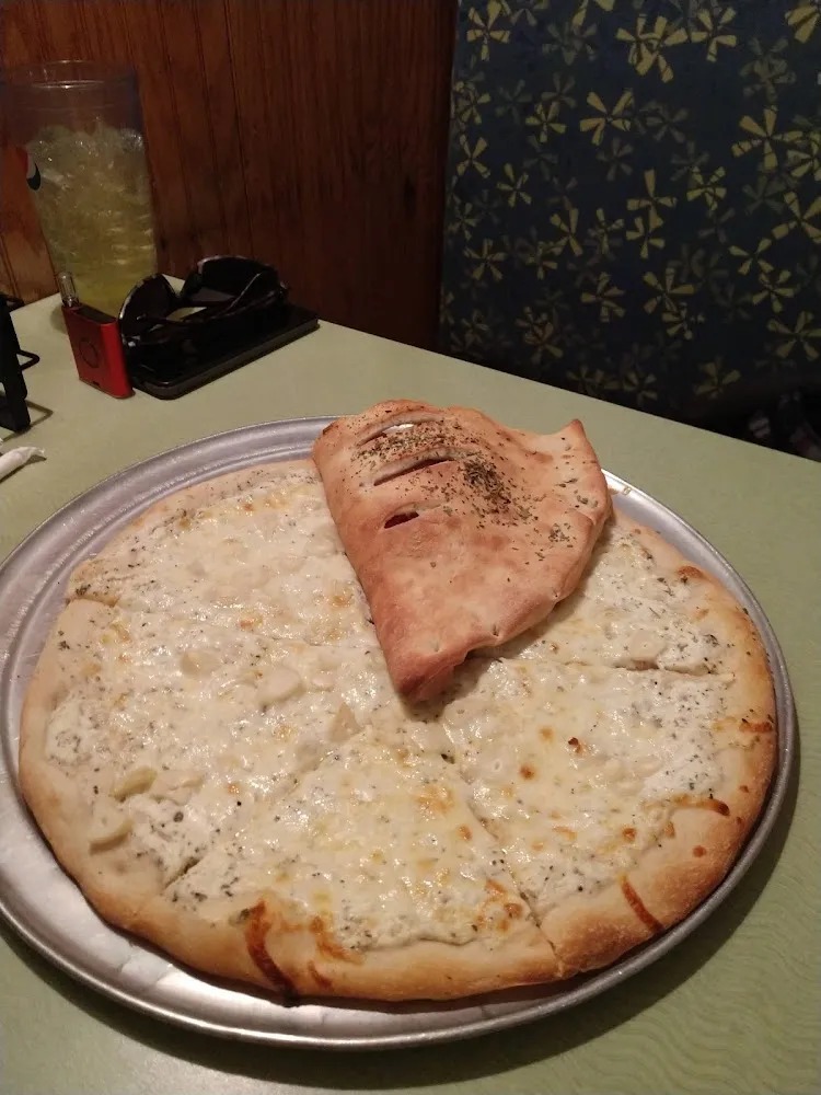 White Pizza with Added Roasted Garlic and Half of a Small Stromboli
